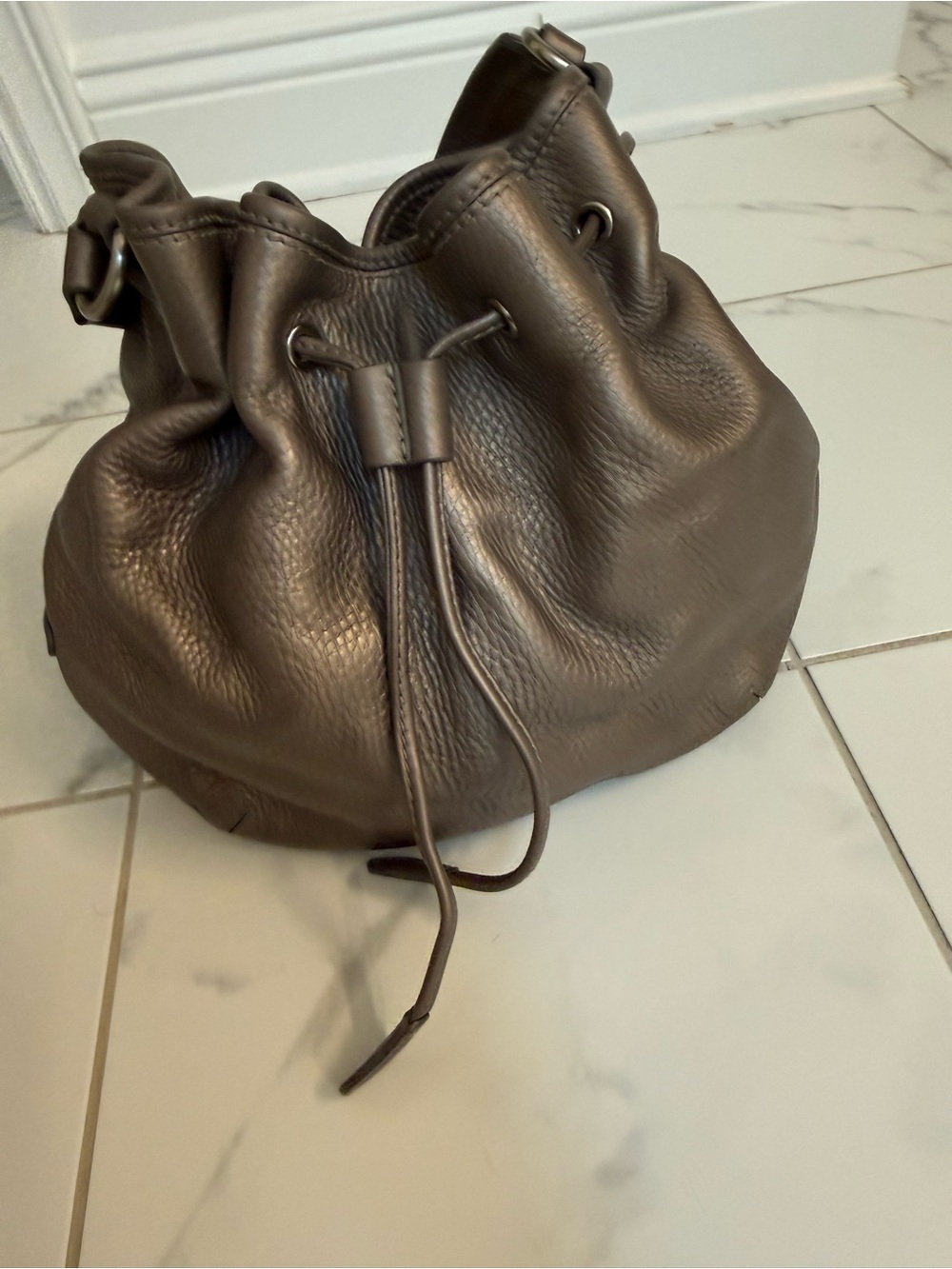 Cole Haan Pebbled Leather Drawstring Bucket Bag in metallic bronze